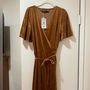 Golden” velvet wrap dress size M. This item is brand new with tags.